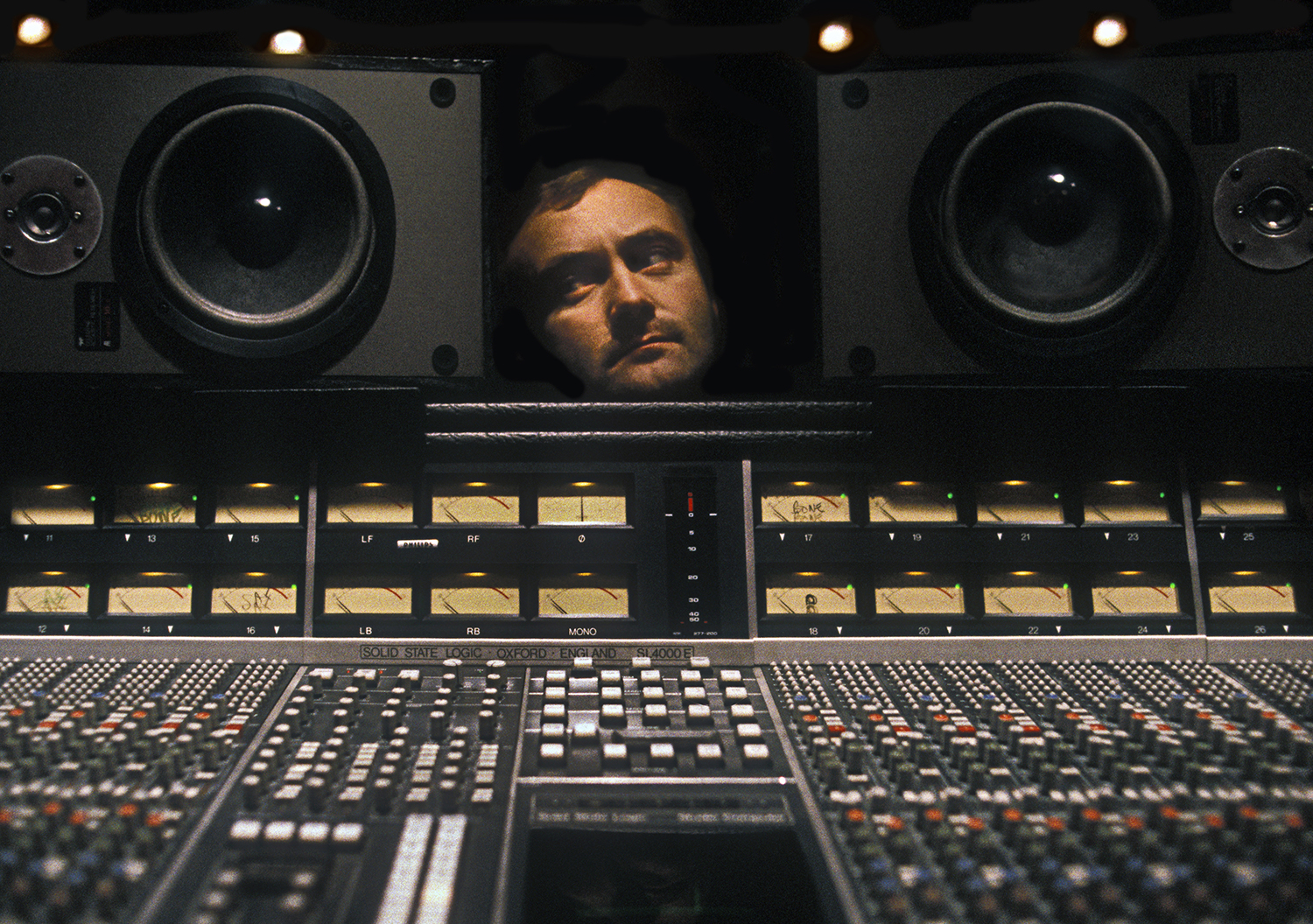 Photo of Phil Collins in his recording studio in Surrey UK 1984
